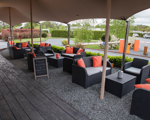 Outside seating area at Concierge Camping in West Sussex.